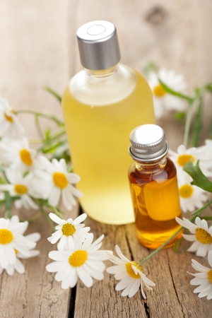 14620056 - essential oil and camomile flowers